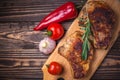 Grilled pork steaks and vegetables on a rustic wooden table. Grilled meat on the bone with spices Royalty Free Stock Photo