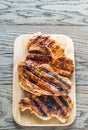 Grilled pork steaks on the wooden board Royalty Free Stock Photo