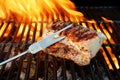 Grilled Pork Striploin, Fork and BBQ Flames Royalty Free Stock Photo