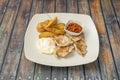 Grilled Pork Tenderloin Combo Plate with Fried Egg, Home Fries Royalty Free Stock Photo