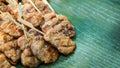 Grilled pork with wood stick serve on green bananaleaf