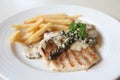 Grilled Porkchop with white sauce Royalty Free Stock Photo