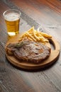 Grilled porterhouse with french fry and beer