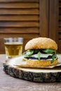 Grilled portobello mushroom burger. Healthy veggies hamburger with onions, arugula, cheese, spicy pickled hot peppers Royalty Free Stock Photo