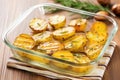 grilled potatoes with fresh sprig of rosemary on a glass serving dish