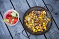 Grilled potatos with onionin and salad