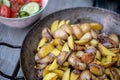 Grilled potatos with onionin and salad