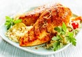 Grilled poultry with couscous on plate Royalty Free Stock Photo