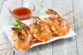 Grilled prawn skewer with sauce