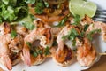 Grilled prawns on bamboo sticks served with salad Royalty Free Stock Photo