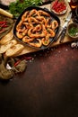 Grilled prawns in cast iron grilling pan with fresh lemon, parsley, chili, garlic white wine sauce Royalty Free Stock Photo