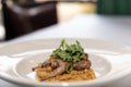 Grilled Quail with Arugula Salad and Cheese Grits