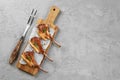 Grilled rack of lamb served on a wooden board Royalty Free Stock Photo