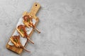 Grilled rack of lamb served on a wooden board. Lamb steaks Royalty Free Stock Photo