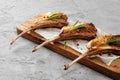 Grilled rack of lamb served on a wooden board. Lamb steaks Royalty Free Stock Photo