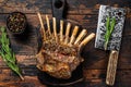 Grilled rack ribs of lamb meat chops. Dark wooden background. Top view Royalty Free Stock Photo