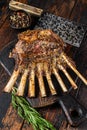 Grilled rack ribs of lamb meat chops. Dark wooden background. Top view Royalty Free Stock Photo