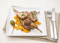 Grilled racks of lamb with carrot, capers Royalty Free Stock Photo