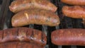 Grilled with rib of beef, chistorra and sausages. Golden sausages ready for the celebration of the picnic. Charcoal grill concept