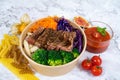 GRILLED RIB-EYE STEAK ROSEMARY RED WINE with salad, tomato and sauce served in a bowl isolated on grey background side view Royalty Free Stock Photo