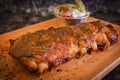 Grilled rib pork with barbecue sauce and vegetable on wooden cutting board. Royalty Free Stock Photo