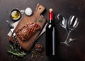 Grilled ribeye beef steak with red wine, herbs and spices Royalty Free Stock Photo