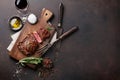 Grilled ribeye beef steak with red wine, herbs and spices Royalty Free Stock Photo