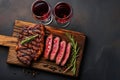 Grilled ribeye beef steak with red wine, herbs and spices. Top view with copy space for your text Royalty Free Stock Photo