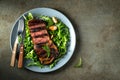 Grilled ribeye beef steak with red wine, herbs and spices. Top view with copy space for your text. Flat lay Royalty Free Stock Photo