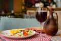 Grilled ribeye beef steak with red wine, herbs and spices on wooden table Royalty Free Stock Photo