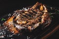 Grilled Ribeye Steak on bones on wooden board, prime cowboy steak Royalty Free Stock Photo