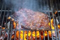 Grilled ribs on the hot flaming grill Royalty Free Stock Photo