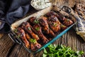 Grilled roasted and barbecue chicken legs in pan Royalty Free Stock Photo