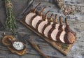 Grilled roasted rack of pork,slice meat chops bone on a portion wooden board Royalty Free Stock Photo