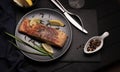 Grilled or roasted salmon with herbs, garlic, spices and lemon. Royalty Free Stock Photo