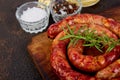 Grilled or Roasted spiral pork sausages with rosemary Royalty Free Stock Photo