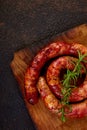 Grilled or Roasted spiral pork sausages with rosemary Royalty Free Stock Photo