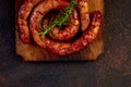 Grilled or Roasted spiral pork sausages with rosemary Royalty Free Stock Photo