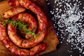Grilled or Roasted spiral pork sausages with rosemary, salt and peper Royalty Free Stock Photo