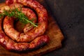 Grilled or Roasted spiral pork sausages with rosemary, salt and peper Royalty Free Stock Photo