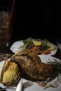 Grilled rosemary chicken dinner with corn and salad. Royalty Free Stock Photo