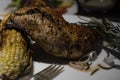 Grilled rosemary chicken dinner with corn and salad. Royalty Free Stock Photo