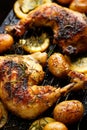 Grilled rosemary lemon chicken quarters with roasted potatoes