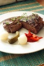 Grilled rump steak with vegetable on a plate