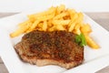 Grilled rumpsteak with fries Royalty Free Stock Photo