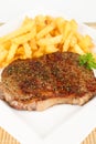 Grilled rumpsteak with fries Royalty Free Stock Photo