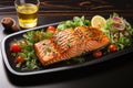 Grilled salmon accompanied by a vibrant tomato and sesame salad