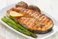 Grilled salmon asparagus and potato on white dish Royalty Free Stock Photo