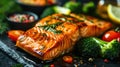 a grilled salmon and broccoli dinner with white wine on a black plate Royalty Free Stock Photo