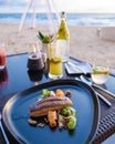 Grilled Salmon, Dinner during sunset on the beach in Phuket Thailand Royalty Free Stock Photo